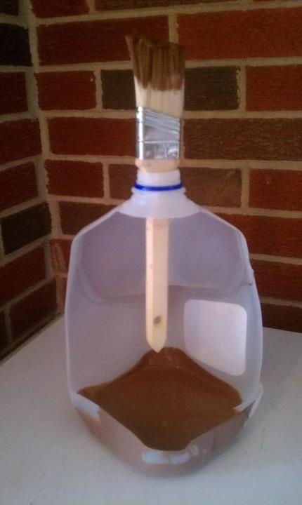 Cut out side of milk container and use bottom to hold paint with built in handle and paint brush holder