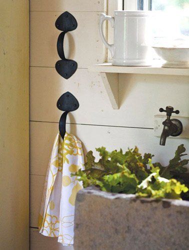 Use Old-Fashioned Handles to Hang Kitchen Towels