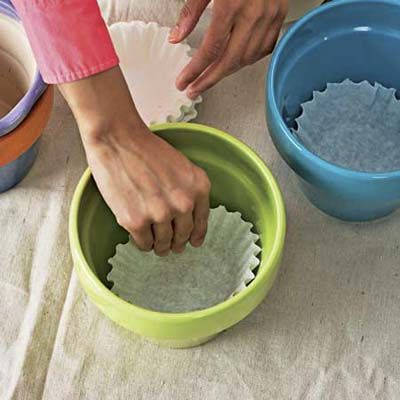 Use coffee filters to keep dirt from falling out
