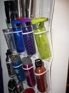 Keep water bottles and travel mugs from falling out of your cabinets