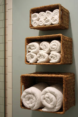 Wall baskets for bath linen storage