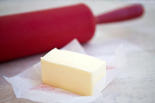To soften butter quickly, place it between two sheets of wax paper