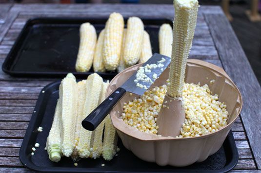 Cut corn off the cob quickly and neatly by holding it steady with a bundt pan