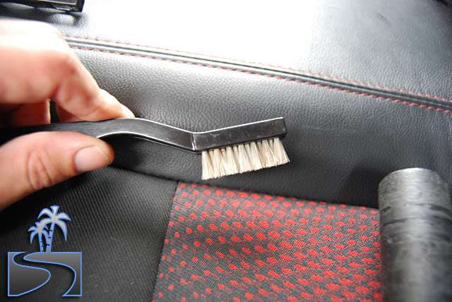 Use the finer bristle Cobra Brush (like a toothbrush) to whisk dust and dirt from folds in the seats