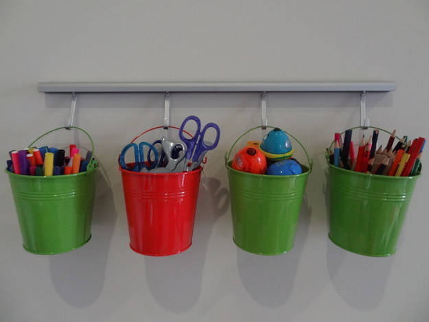 Use buckets to organize their art supplies