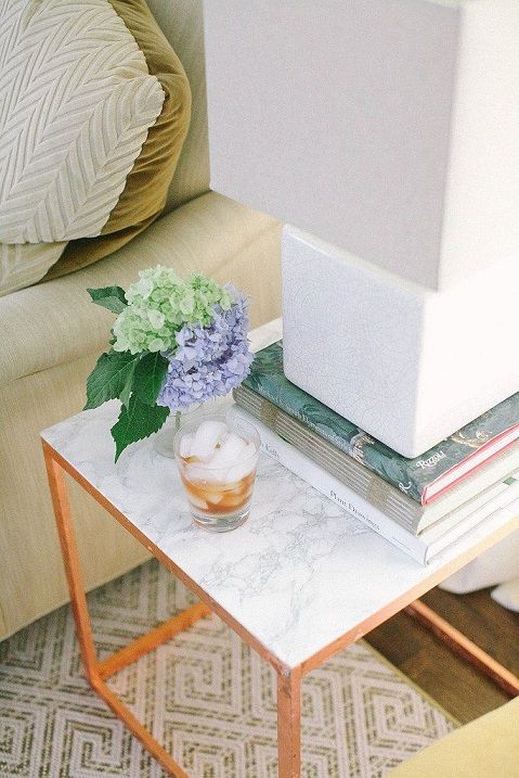 Add a bit of marble and a splash of gold to the side table