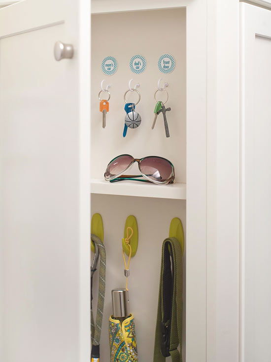 Add hooks to the back of a shallow cabinet near the family entry to keep track of keys