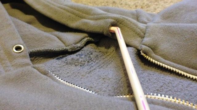 Use a straw to restring your hoodie