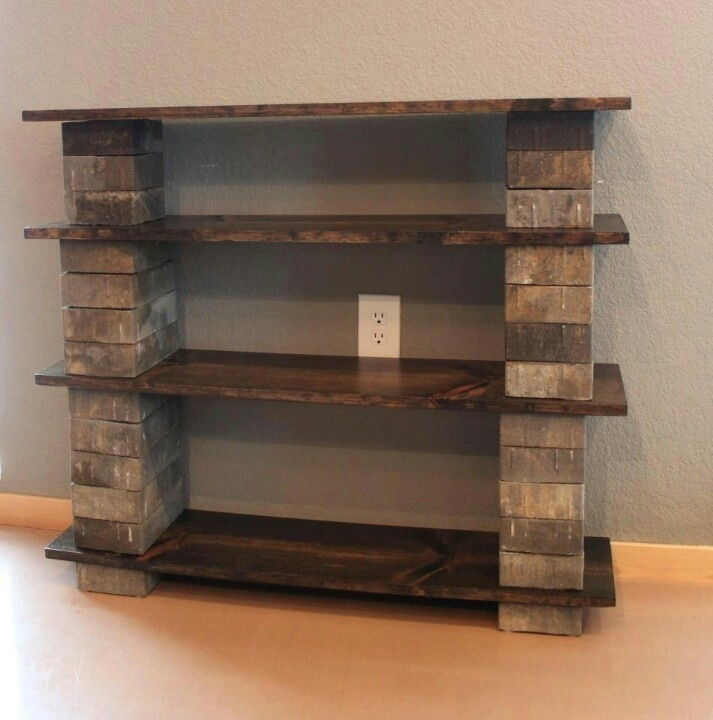 Make a rustic bookshelf with wooden boards and cinder blocks