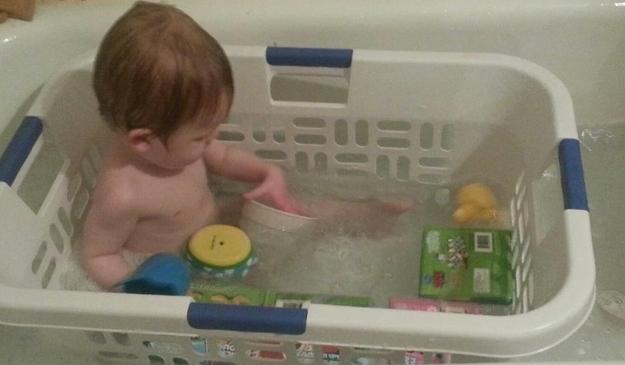Bathe your child in a laundry basket so that their toys don’t float away