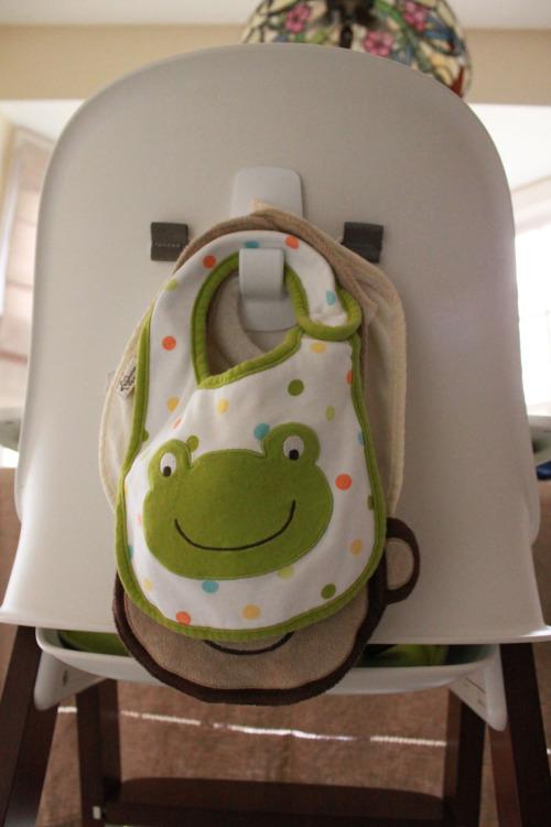 Putting a hook on the back of your highchair for bibs