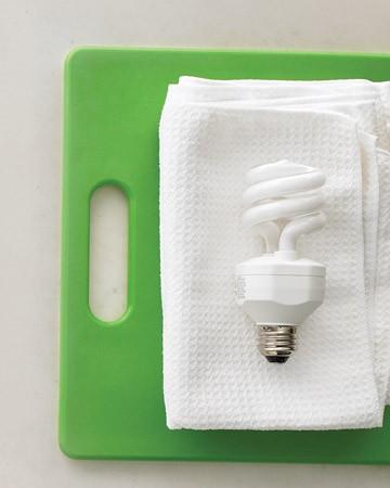 Unscrew light bulbs and polish the bulbs with a microfiber cloth dampened with water