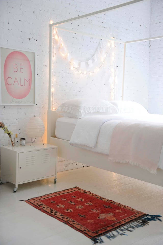 Create a calming space with lights over your bed
