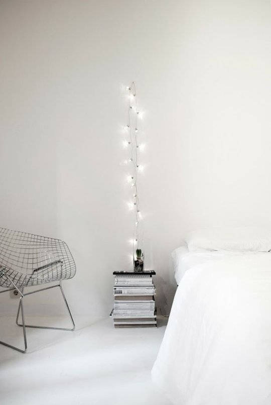 Hang a string light beside your bed instead of a table lamp for a modern look
