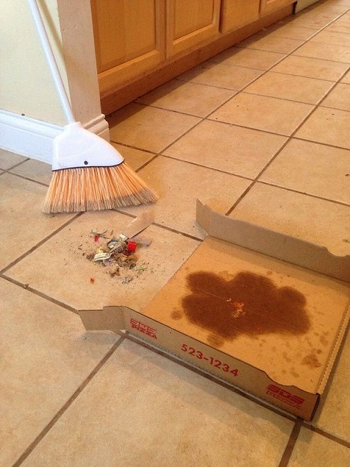 Use a pizza box as a dust pan