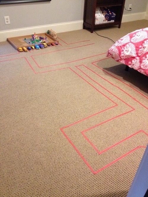 Tape off a track on the floor for car play