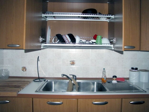 Install a dish draining closet over the sink