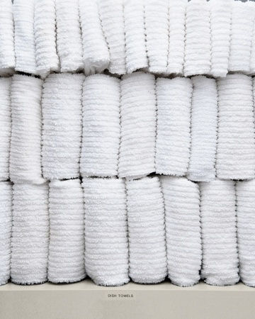 Dish towels, should be neatly folded and stacked for easy access