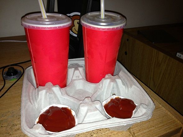 Prevent messes in the car by placing dipping ketchup cups in drink cup holders