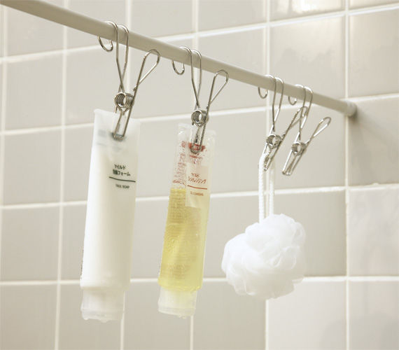 Use shower curtain rod to hang bath toiletries