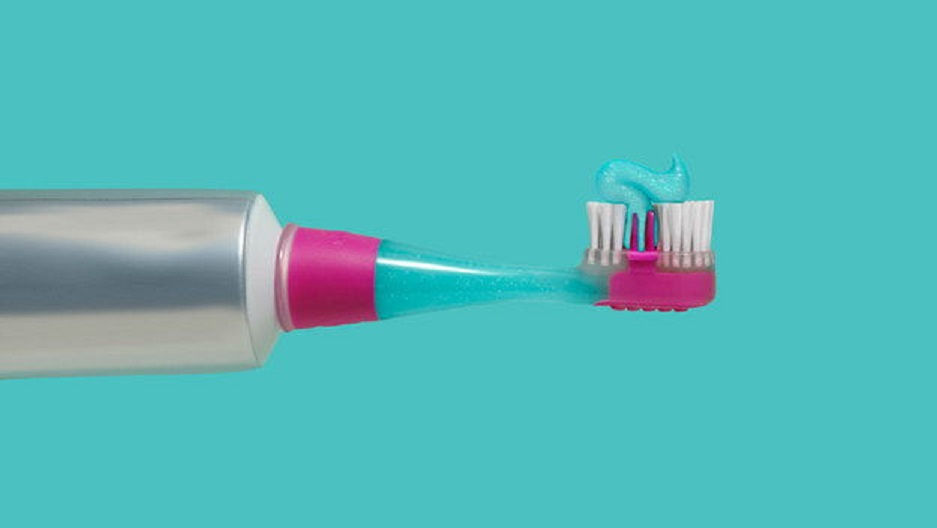 Toothbrush With Toothpaste In Handle