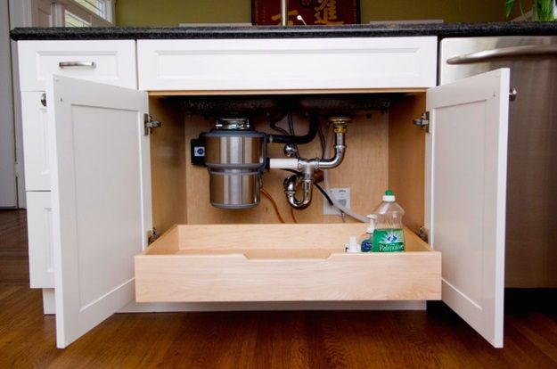 Install a pull-out drawer underneath the sink