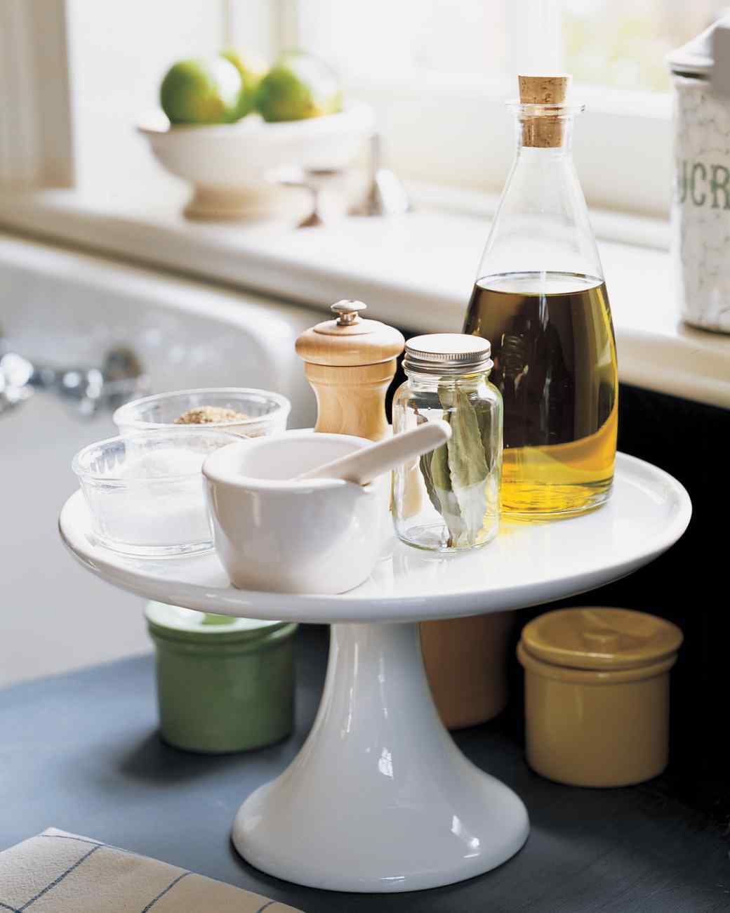 Clear up the clutter and make the most of your countertops by using a cake stand